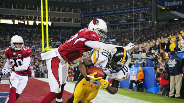 2009-0201-Super-Bowl-XLIII-Santonio-Holmes-Aaron-Francisco-opgm-51894.jpg